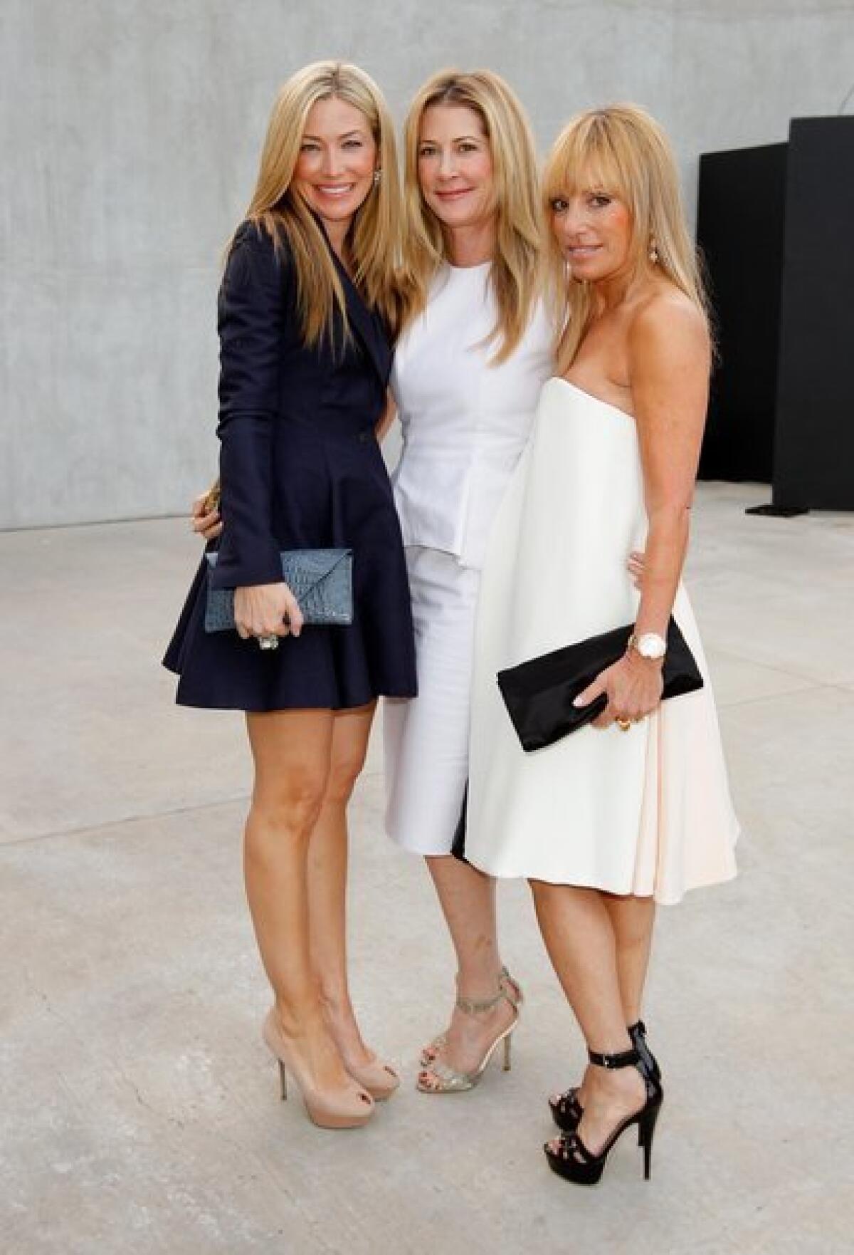From left, hosts Quinn Ezralow, Kelly Styne and Julia Sorkin at Maxfield's celebration of Raf Simons' debut ready-to-wear collection.