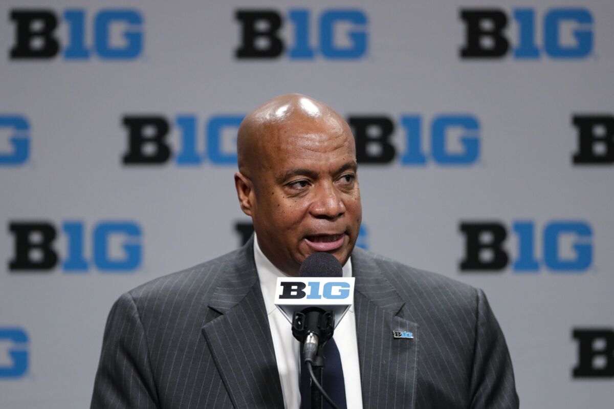 FILE - In this March 12, 2020, file photo, Big Ten Commissioner Kevin Warren addresses the media in Indianapolis. The Big Ten’s plan to play football this fall includes trying to save lives in the future. The conference announced Wednesday, Sept. 16, 2020, it would have a football season this fall. The Big Ten is setting up a cardiac registry to study the effects COVID-19 has on student-athletes' hearts. Big Ten Commissioner Kevin Warren said it will help all students, surrounding communities, and the entire nation. (AP Photo/Michael Conroy, File)