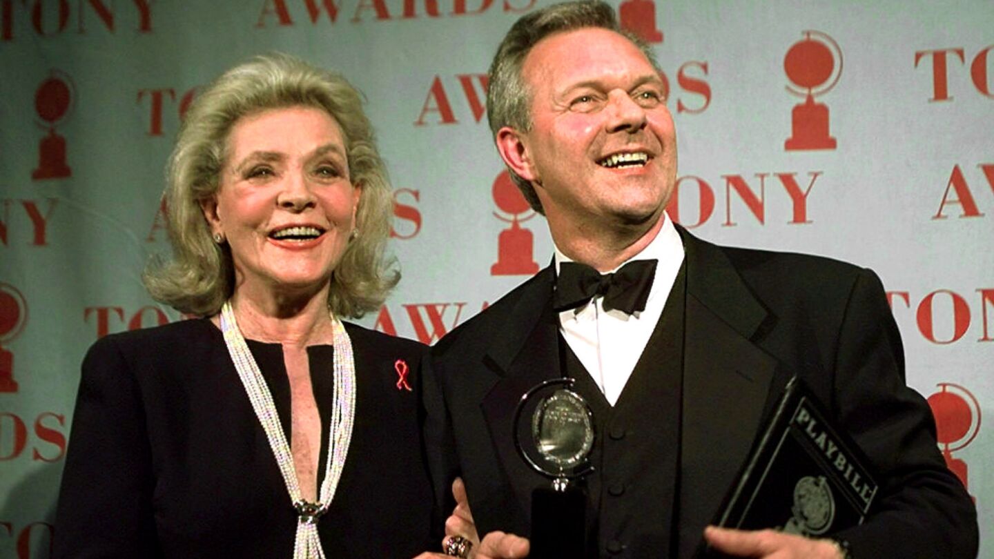Theater director Walter Bobbie poses with his Tony Award for director of a musical for "Chicago" with Bacall, who presented the award during the 1997 Tony Awards at Radio City Music Hall. Bacall was a Tony winner herself, in 1970 and 1981.