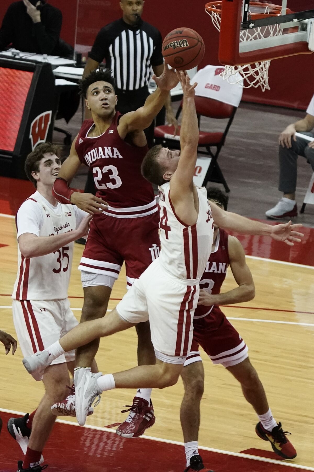 Indiana's Trayce Jackson-Davis block the shot of Wisconsin's Brad Davison during overtime of an NCAA college basketball game Thursday, Jan. 7, 2021, in Madison, Wis. (AP Photo/Morry Gash)