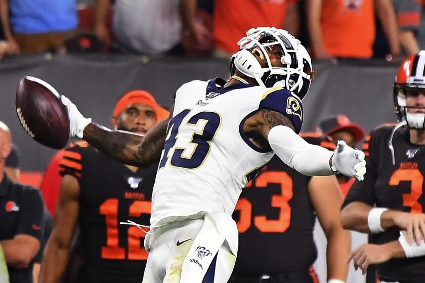 Wally Skalij  Los Angeles Times RAMS SAFETY John Johnson celebrates his interception in the end zone.