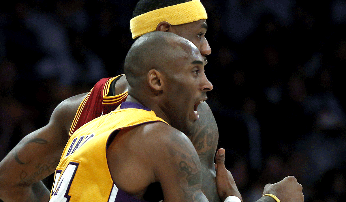 Kobe Bryant guards Cleveland star LeBron James during a Jan. 15 game at Staples Center.