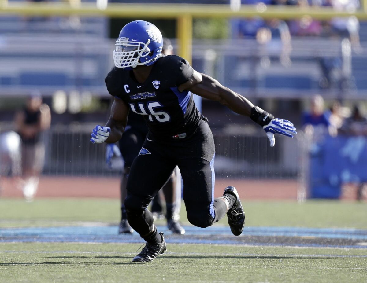 Buffalo linebacker Khalil Mack (46) runs on the field during the first half of an NCAA football game against the Connecticut
