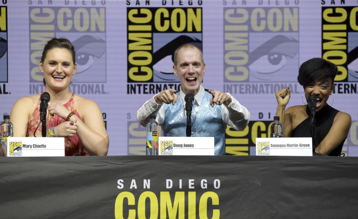 Mary Chieffo, from left, Doug Jones and Sonequa Martin-Green react to the crowd at the "Star Trek: Discovery" panel on day two of Comic-Con International.