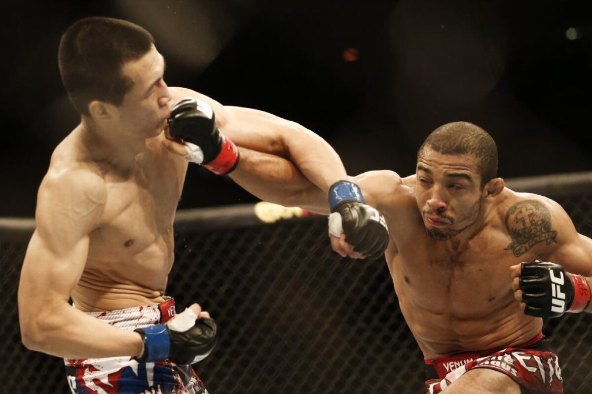 Jose Aldo, right, and Chan Sung Jung fight. in Rio de Janeiro, Brazil, Sunday, Aug. 4, 2013. (AP Photo/Felipe Dana) ** Usable by LA and DC Only **