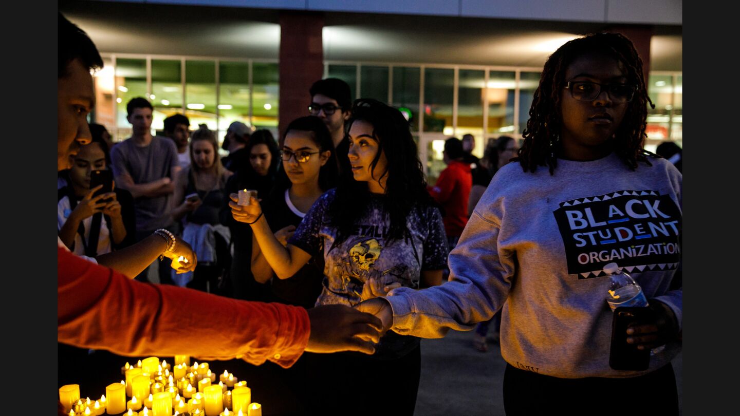 UNLV students pick up candles for a vigil for the victims of the mass shooting in Las Vegas.