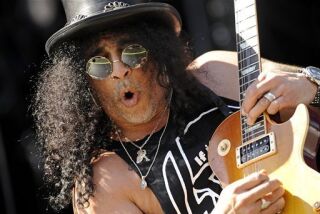 FILE - In this 2010 file photo, guitarist Slash performs in in Nuremberg, Germany. (AP Photo/Joerg Koch)