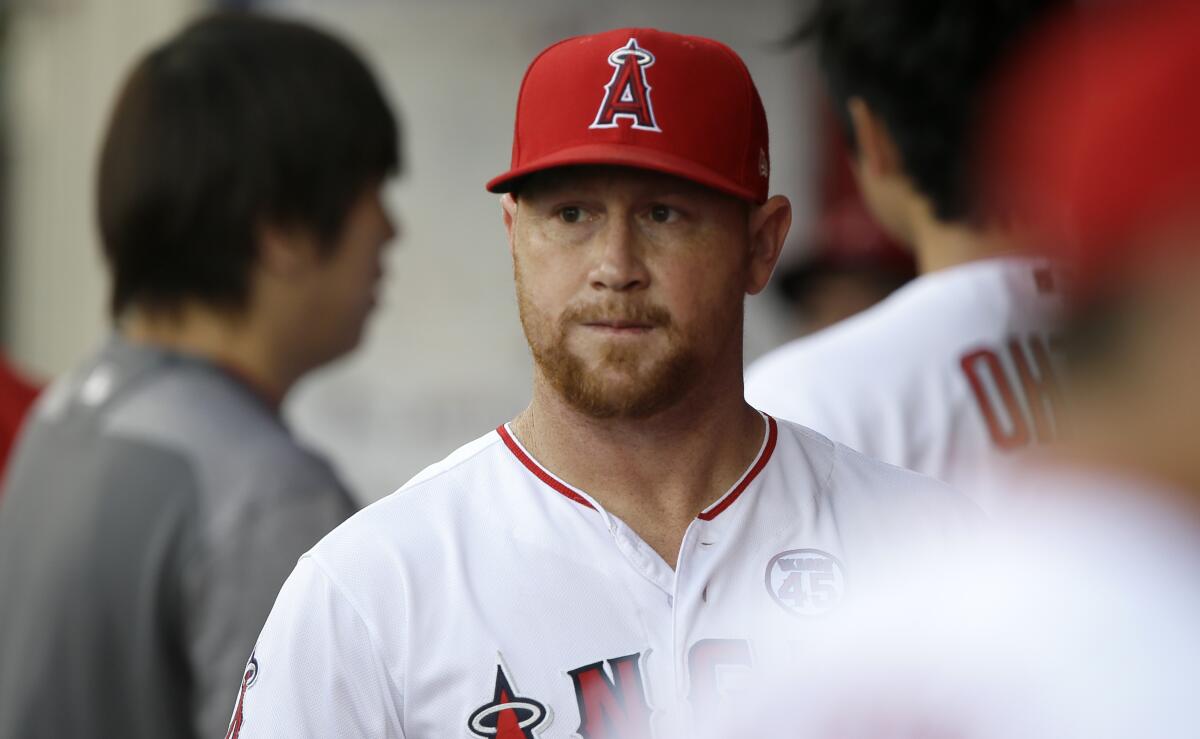Angels outfielder Kole Calhoun walks through the dugout before a game against the Detroit Tigers on July 30.