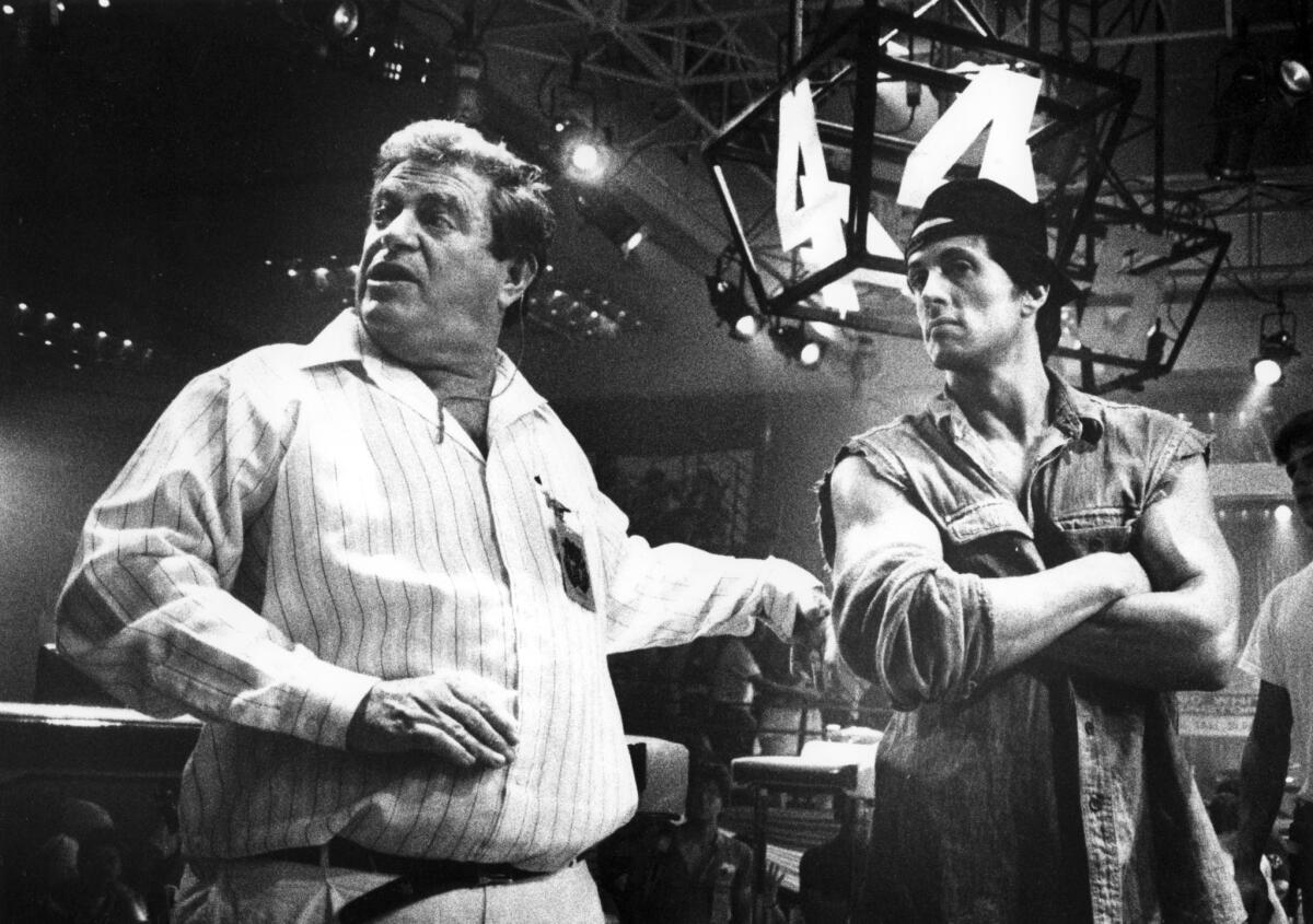 Director Menahem Golan with Sylvester Stallone on the set of "Over the Top" in 1986.