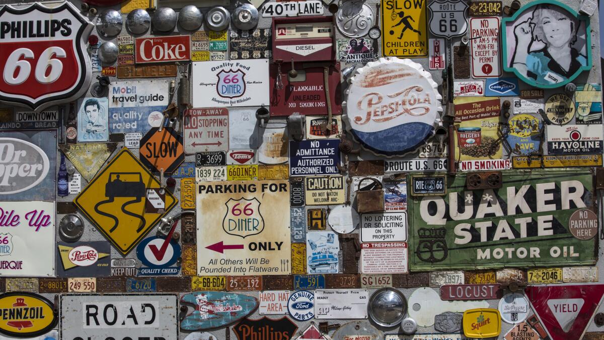 Vintage signs on a Route 66 restaurant on Central Ave. in Albuquerque, New Mexico. (Brian van der Brug / Los Angeles Times)
