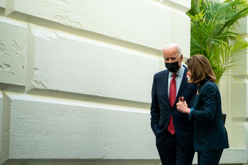 WASHINGTON, DC - OCTOBER 01: President Joe Biden and Speaker of the House Nancy Pelosi (D-CA) leave a House Democratic Caucus meeting in the U.S. Capitol on Friday, Oct. 1, 2021 in Washington, DC. The President called the meeting in order to push through an impasse with his $1 trillion infrastructure plan. (Kent Nishimura / Los Angeles Times)