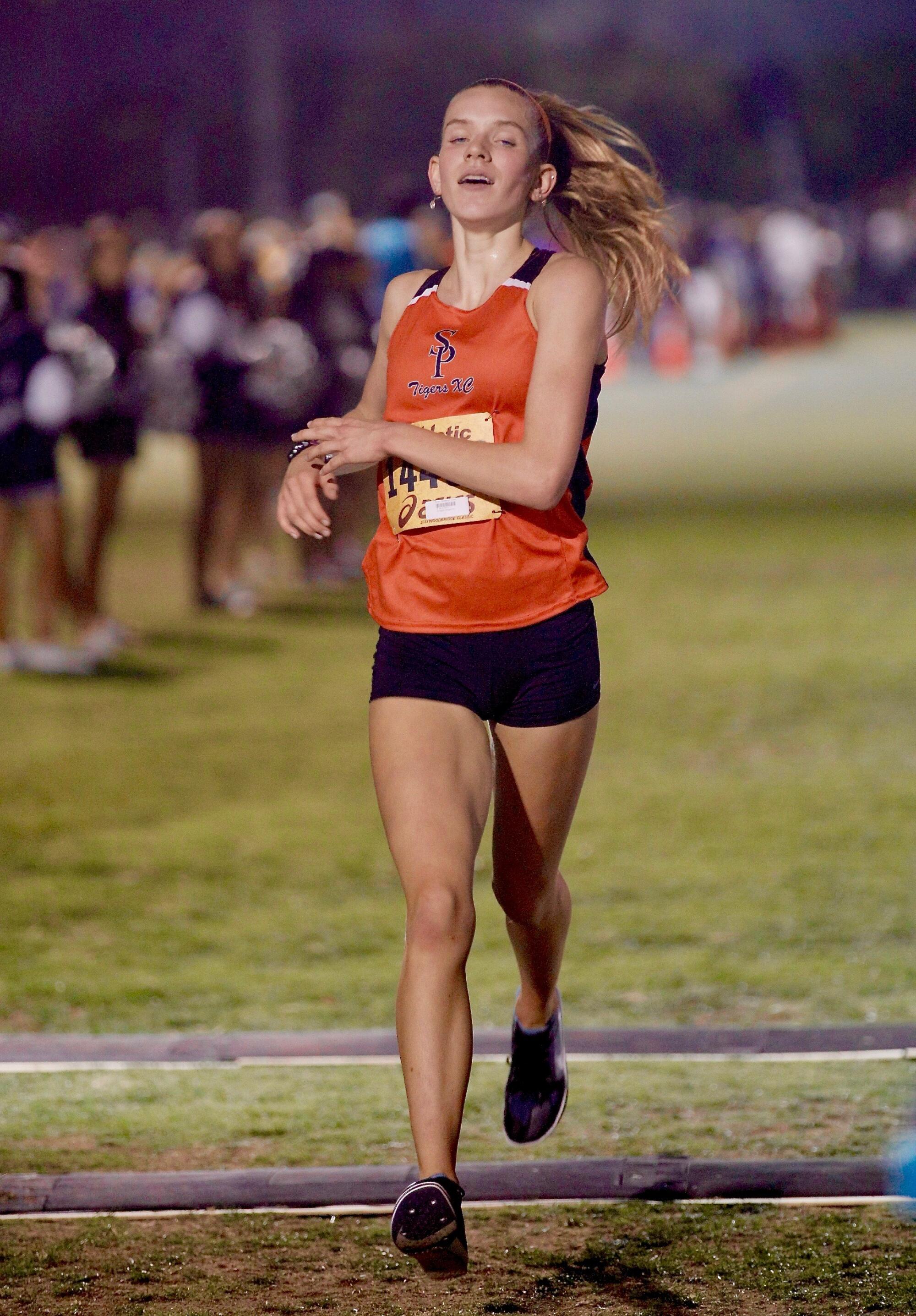 South Pasadena junior Abigail Errington wins the girls' rated race while leading the Tigers to first out of 31 teams.