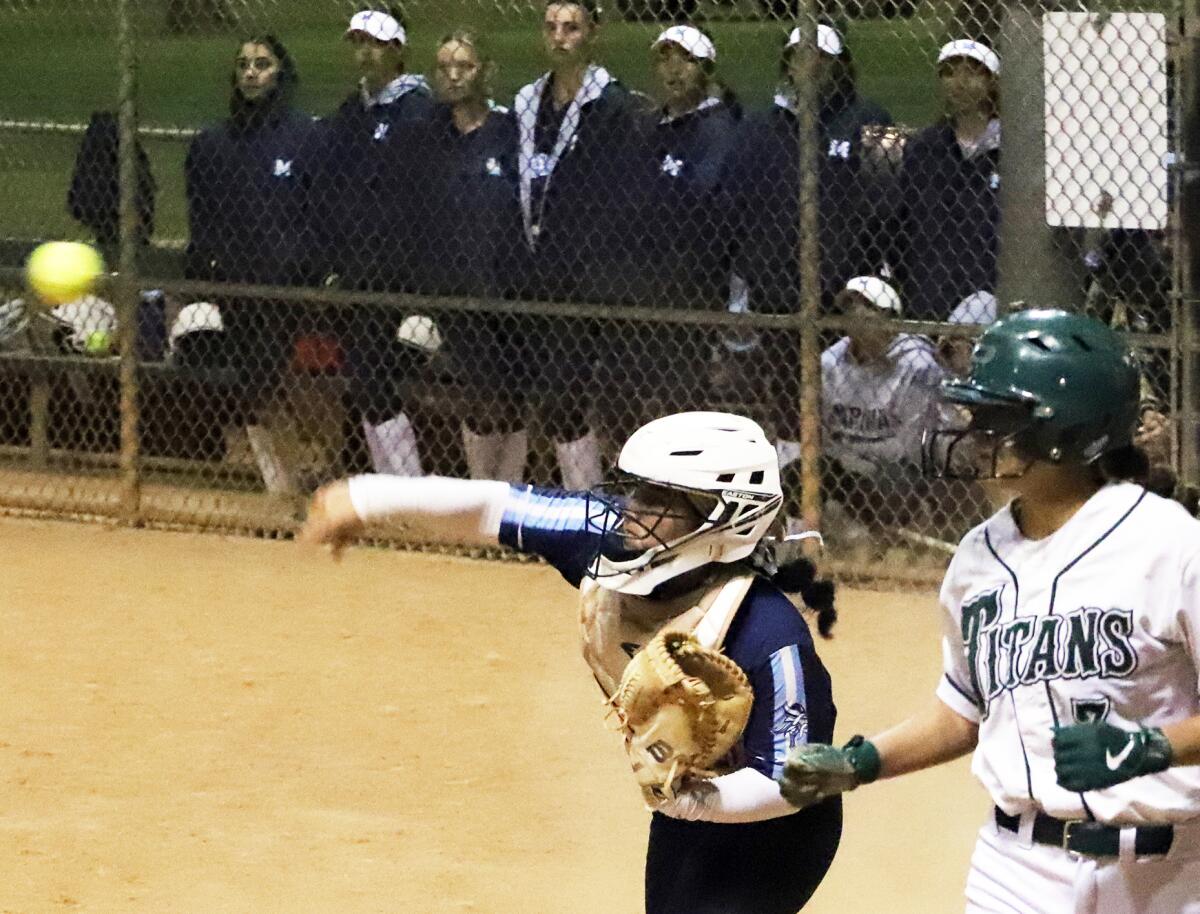 Marina catcher Gabby DiBenedetto (29) gets the out at home and throws to third base for a double play against Poway.