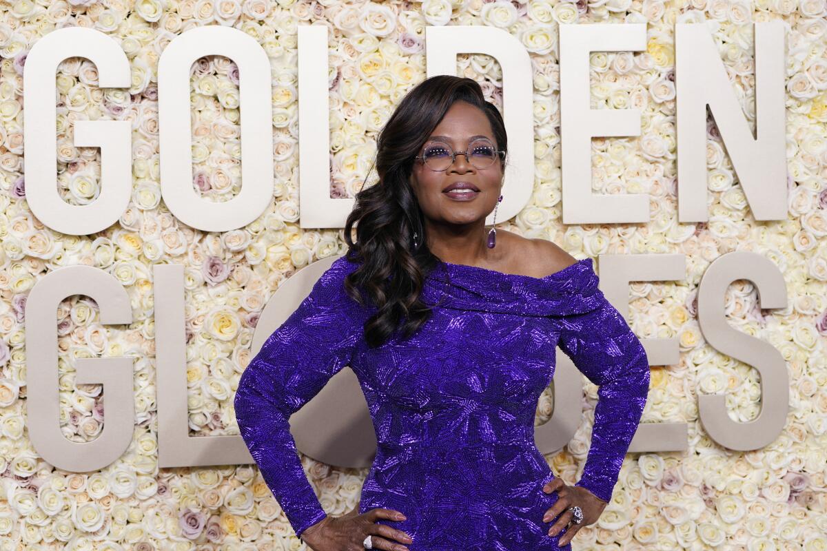 oprah skinny purple dress Oprah Winfrey stuns in form-fitting purple gown at the Academy Museum Gala