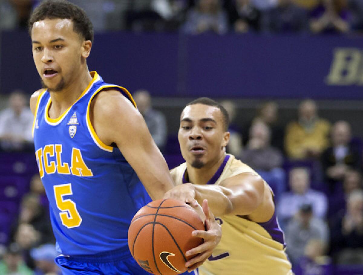 UCLA guard Kyle Anderson, driving past Washington guard Andrew Andrews on Thursday, leads the Bruins in rebounds and assists this season with averages of 8.6 and 6.7 a game, respectively.
