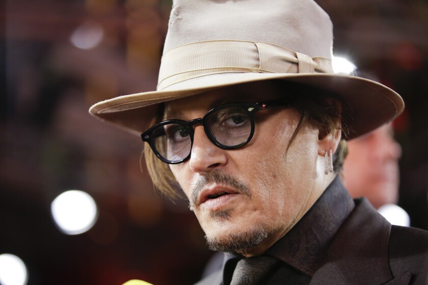 FILE - In this Friday, Feb. 21, 2020 file photo, actor Johnny Depp arrives for the screening of the film Minamata during the 70th International Film Festival Berlin, Berlinale in Berlin, Germany. A British judge on Thursday July 2, 2020, rejected an attempt by tabloid newspaper The Sun to quash a libel suit from Johnny Depp over an article claiming he abused ex-wife Amber Heard. (AP Photo/Markus Schreiber, File)