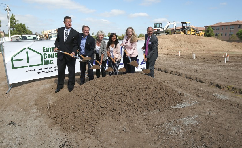 County and Irvine officials gather for a ceremonial ground-breaking for an affordable housing development.