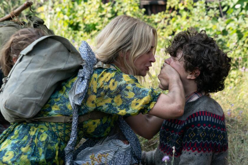 Evelyn (Emily Blunt) and Marcus (Noah Jupe) brave the unknown in "A Quiet Place Part II." Photo Credit: Jonny Cournoyer