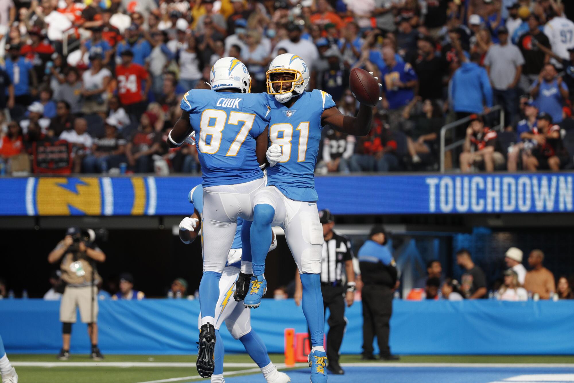 Chargers wide receiver Mike Williams celebrates with tight end Jared Cook after scoring a fourth-quarter touchdown.