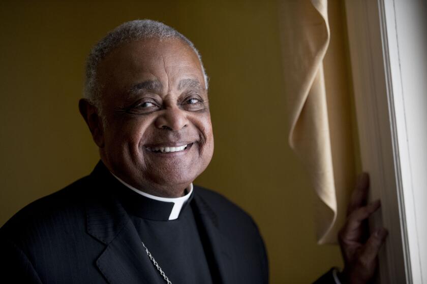 FILE - This Sunday, June 2, 2019, file photo shows Washington D.C. Archbishop Wilton Gregory posed for a portrait following mass at St. Augustine Church in Washington. Pope Francis has named 13 new cardinals, including Washington D.C. Archbishop Wilton Gregory, who would become the first Black U.S. prelate to earn the coveted red cap. In a surprise announcement from his studio window to faithful standing below in St. Peter’s Square, Sunday, Oct. 25, 2020, Francis said the churchmen would be elevated to a cardinal’s rank in a ceremony on Nov. 28. (AP Photo/Andrew Harnik, File)