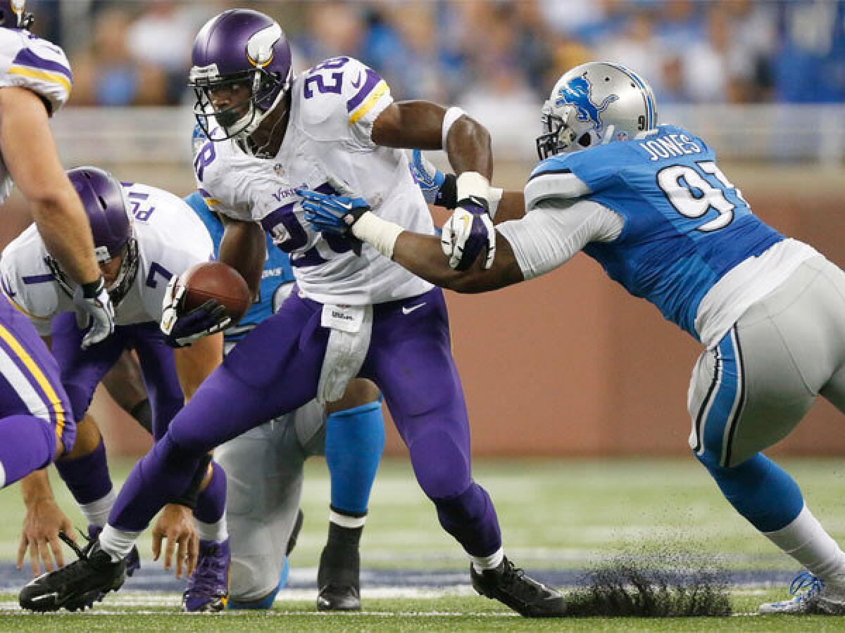 Minnesota's Adrian Peterson, shown running against Detroit's Jason Jones last week, came off of reconstructive knee surgery to finish nine yards short of the single-season rushing record in 2012.