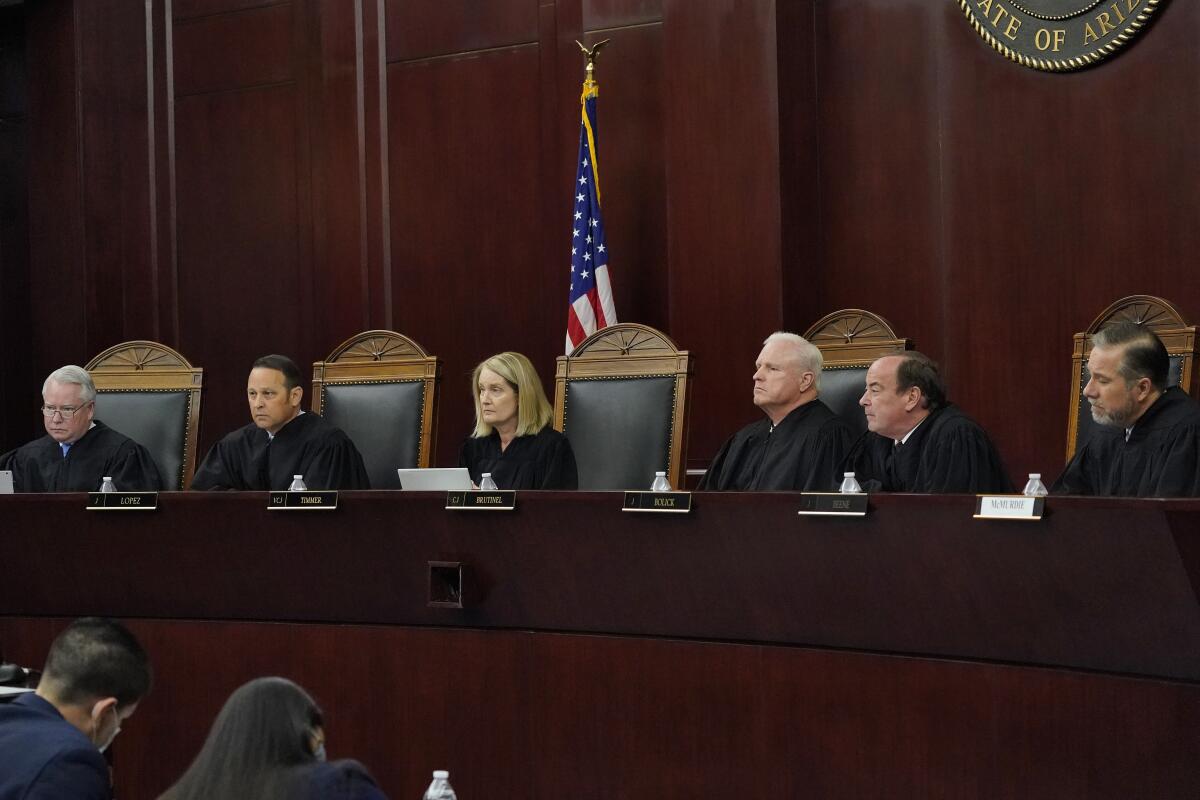 Six Arizona Supreme Court justices listening to oral arguments