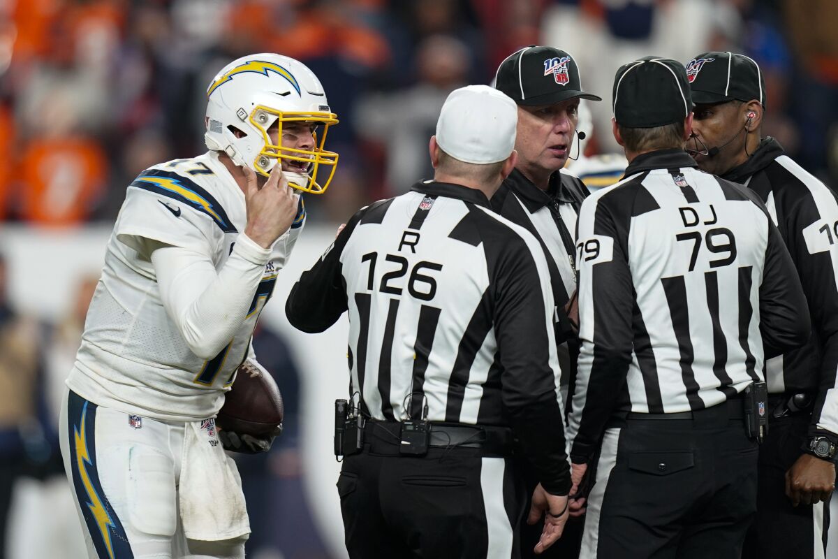 Chargers quarterback Philip Rivers talks with the officials during the second half of a game against the Broncos on Dec. 1.