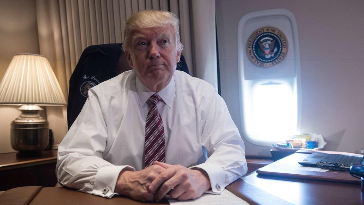 President Trump in his office aboard Air Force One on Thursday after he spoke in Philadelphia.