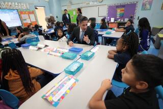 Los Angeles, CA - August 14: Lenicia B. Weemes Elementary School on Monday, Aug. 14, 2023 in Los Angeles, CA. LAUSD Supt. Alberto Carvalho sits with third grade students as he visits classrooms at Lenicia B. Weemes Elementary School on the first day of classes for LAUSD students. (Al Seib / For The Times)