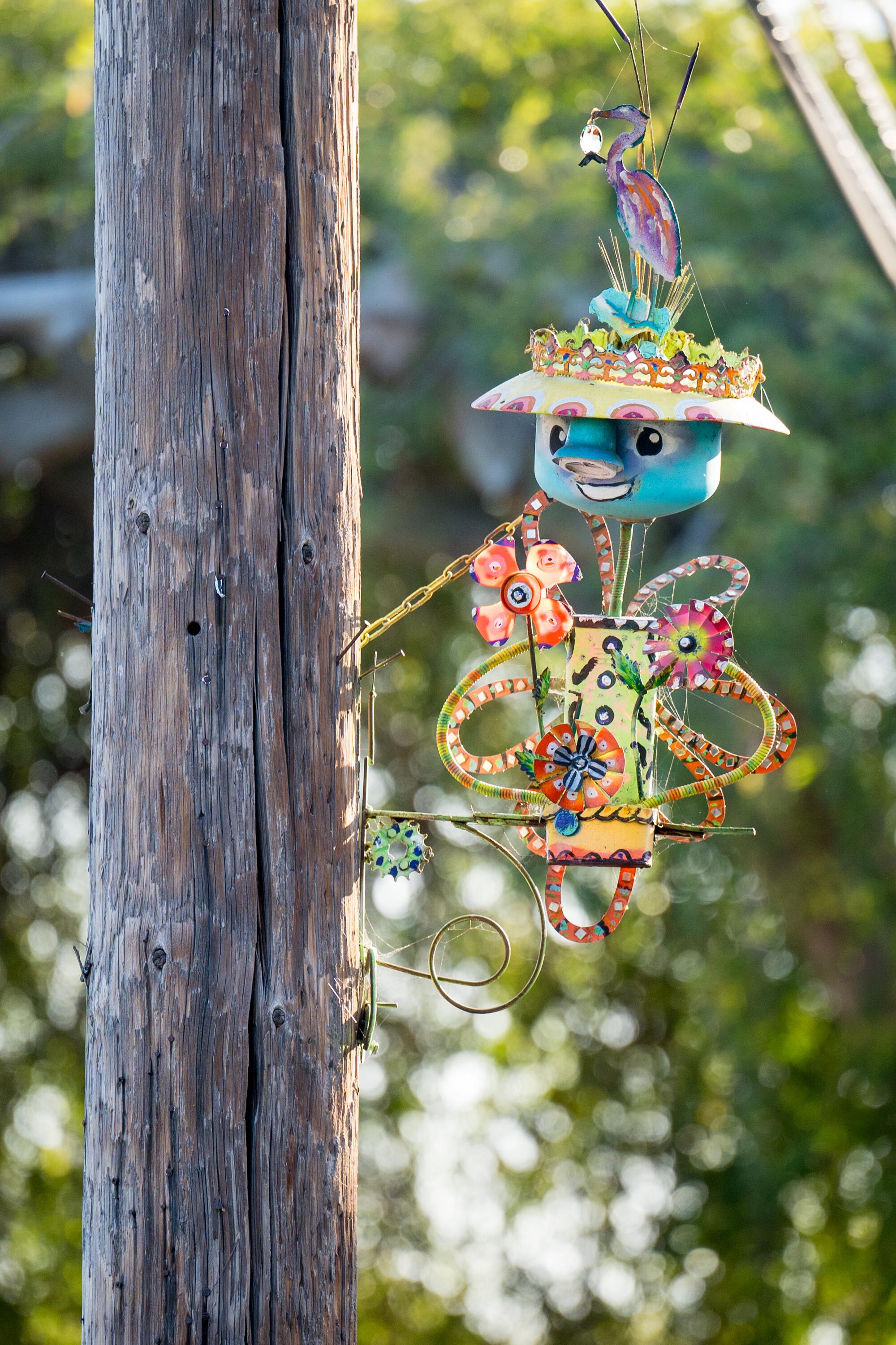 Colourful sculpture on a pillar.