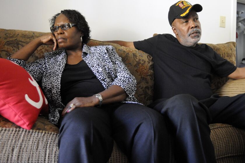 FILE - In this Nov. 16, 2016 file photo, Sarah Collins Rudolph and her husband, George Rudolph, discuss their worries about the upcoming Donald Trump presidency in their home in Birmingham, Ala.. Rudolph, the survivor of the 1963 church bombing that killed four little girls, is seeking an apology and restitution from the state of Alabama. (AP Photo/Jay Reeves)