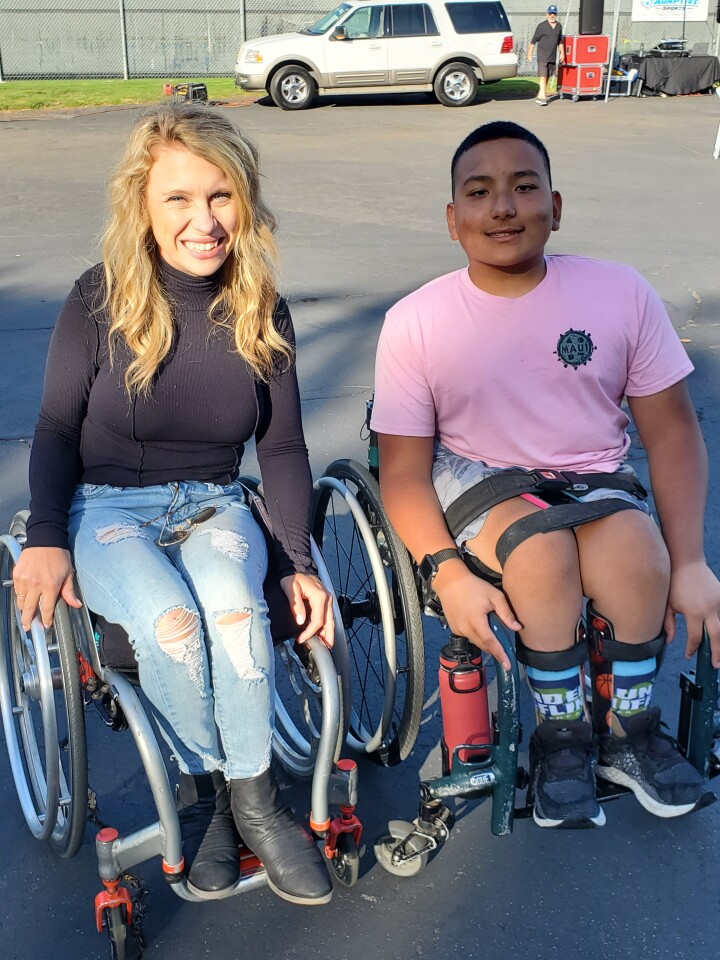 Adaptive Sports and Recreation Association camper-turned-counselor Allie Cardwell and current camper Kamden Houshan
