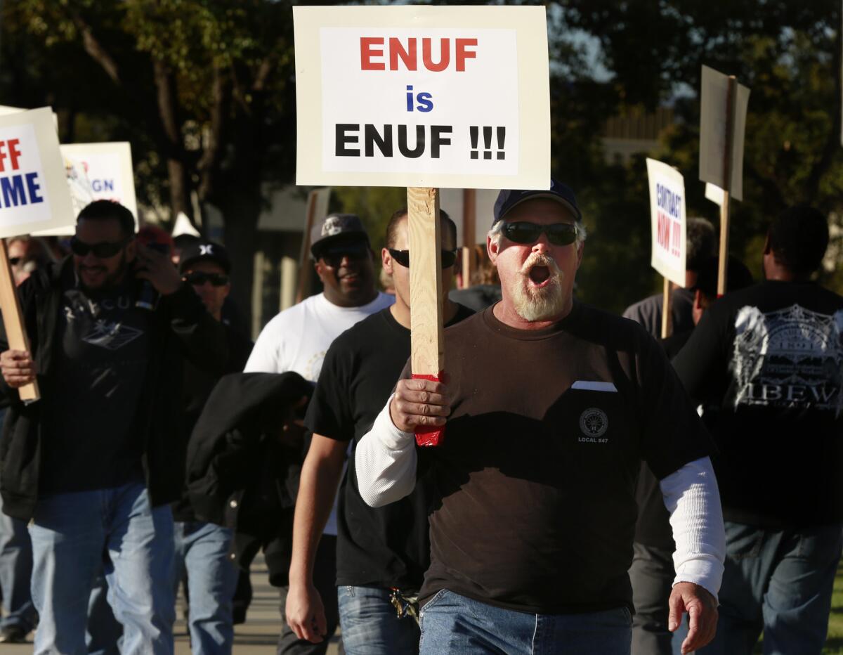 More than 300 members of the International Brotherhood of Electrical Workers rally on Feb. 10 at the Southern California Edison offices in Irvine in support of their fellow Edison employees and to protest what they say are unfair labor practices at the Southland's largest utility.