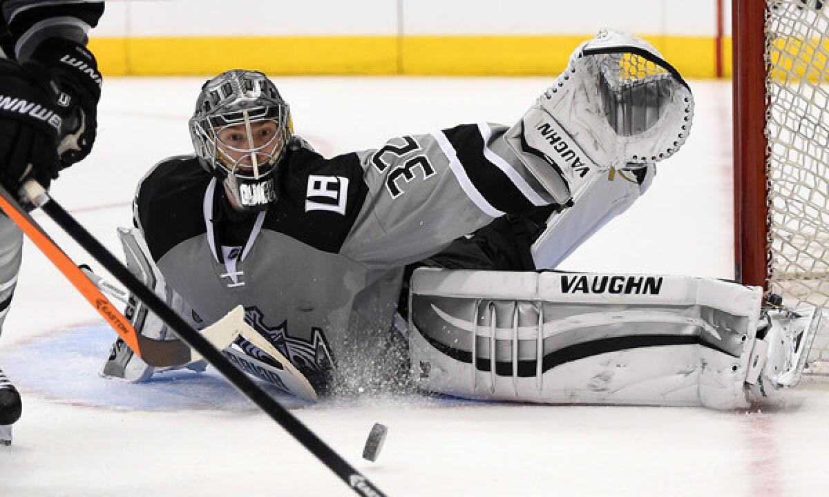 Kings goalie Jonathan Quick stops a shot during a loss to the Ducks on Saturday. The Kings hope Quick will put up a playoff performance reminiscent of how well he played during the team's 2012 Stanley Cup run.