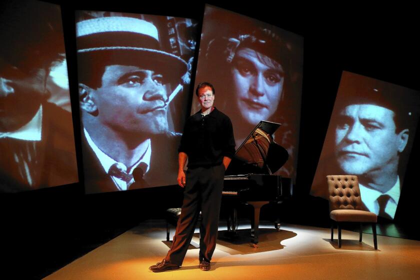 Chris Lemmon in front of images of his father, Jack Lemmon, on the set of "Jack Lemmon Returns."