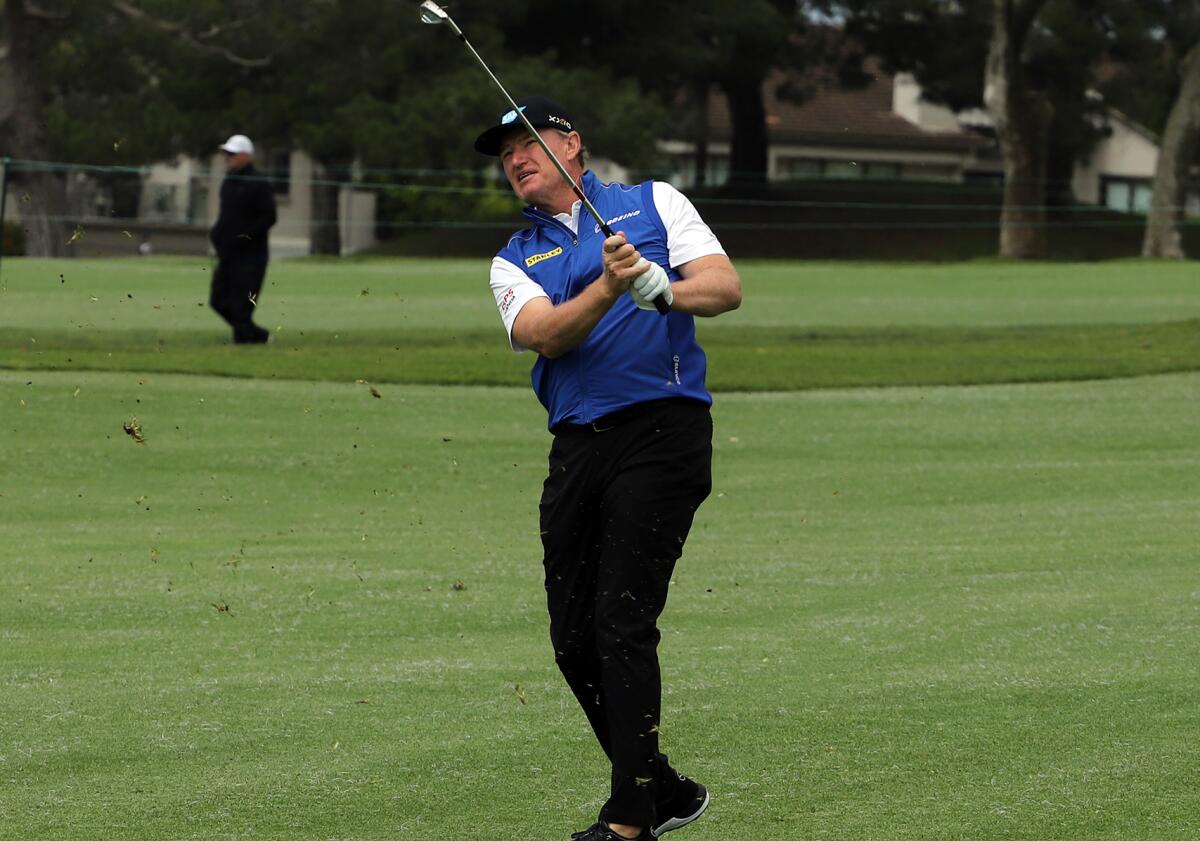 Ernie Els of South Africa hits an approach shot at the Hoag Classic in Newport Beach on Saturday.