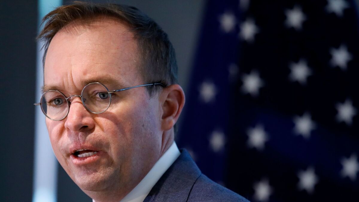 Mick Mulvaney, who is President Trump's budget director, is now also acting director of the Consumer Financial Protection Bureau.