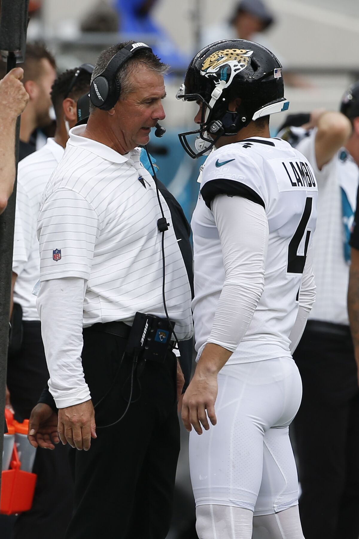 Jacksonville Jaguars head coach Urban Meyer, left, talks with place kicker Josh Lambo after Lambo missed his second field goal against the Denver Broncos during the first half of an NFL football game, Sunday, Sept. 19, 2021, in Jacksonville, Fla. (AP Photo/Stephen B. Morton)