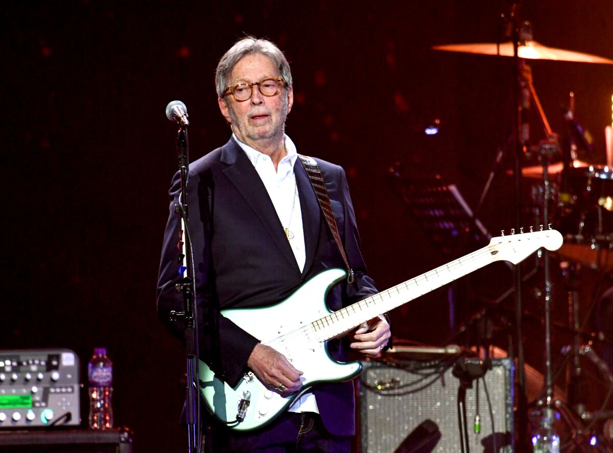 Eric Clapton on stage with electric guitar 