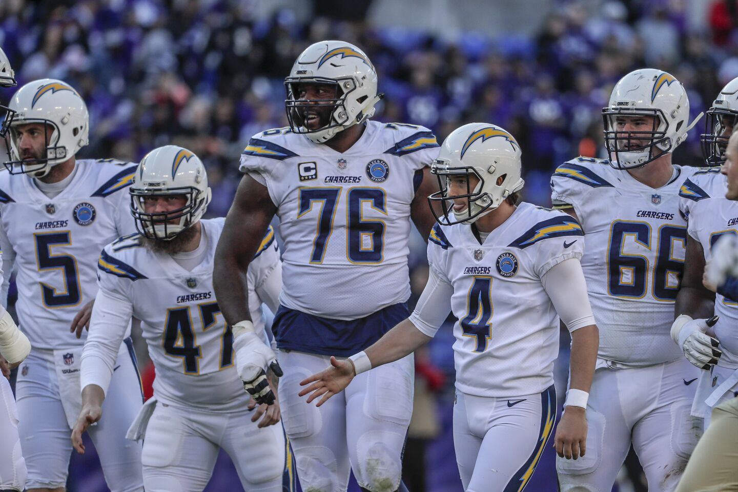 Chargers kicker Michael Badgley is congratulated by teammates after hitting a 34-yard field goal in the second quarter in the AFC wild-card playoff game.