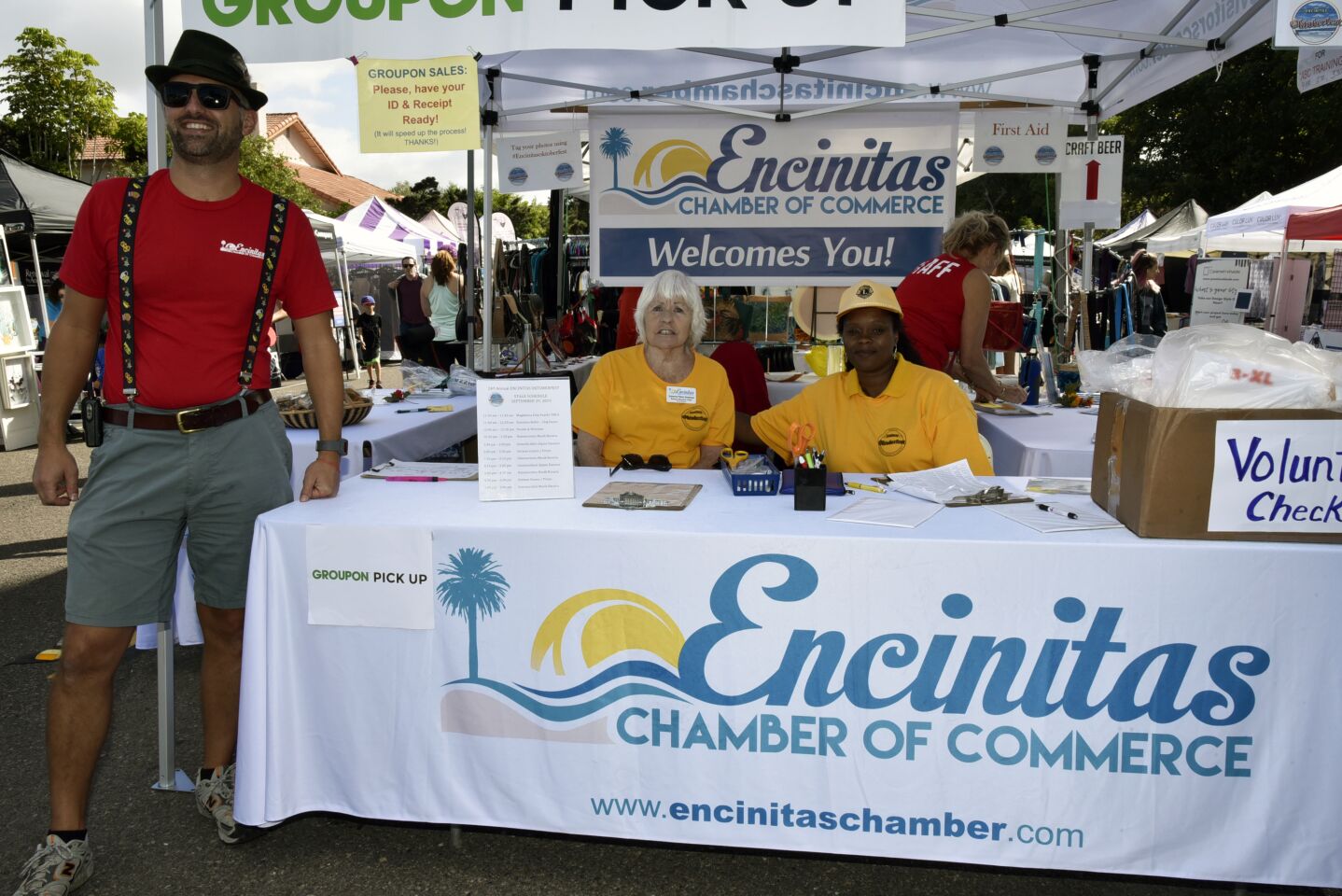Encinitas Chamber of Commerce board members Jon Kochik and Suzanne Perez-Swanson, Encinitas Lion’s volunteer Rachel White