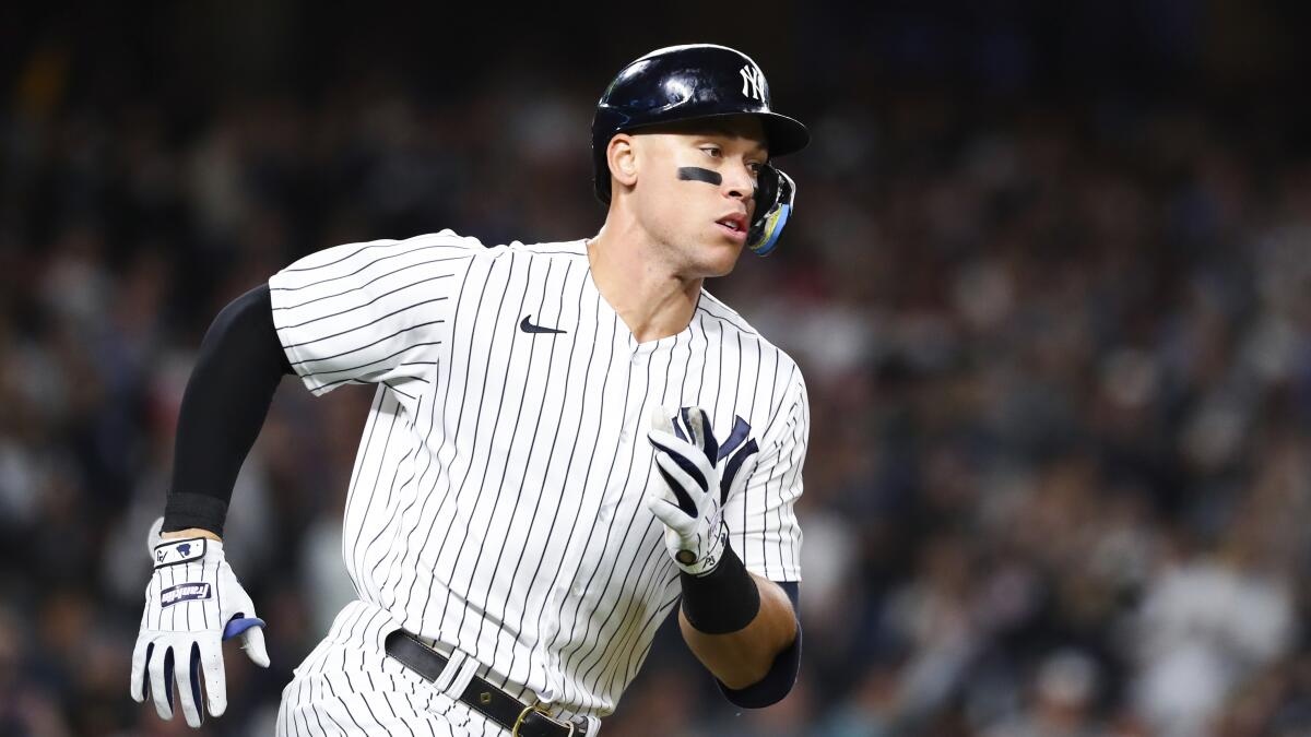 New York Yankees designated hitter Aaron Judge runs towards first base.