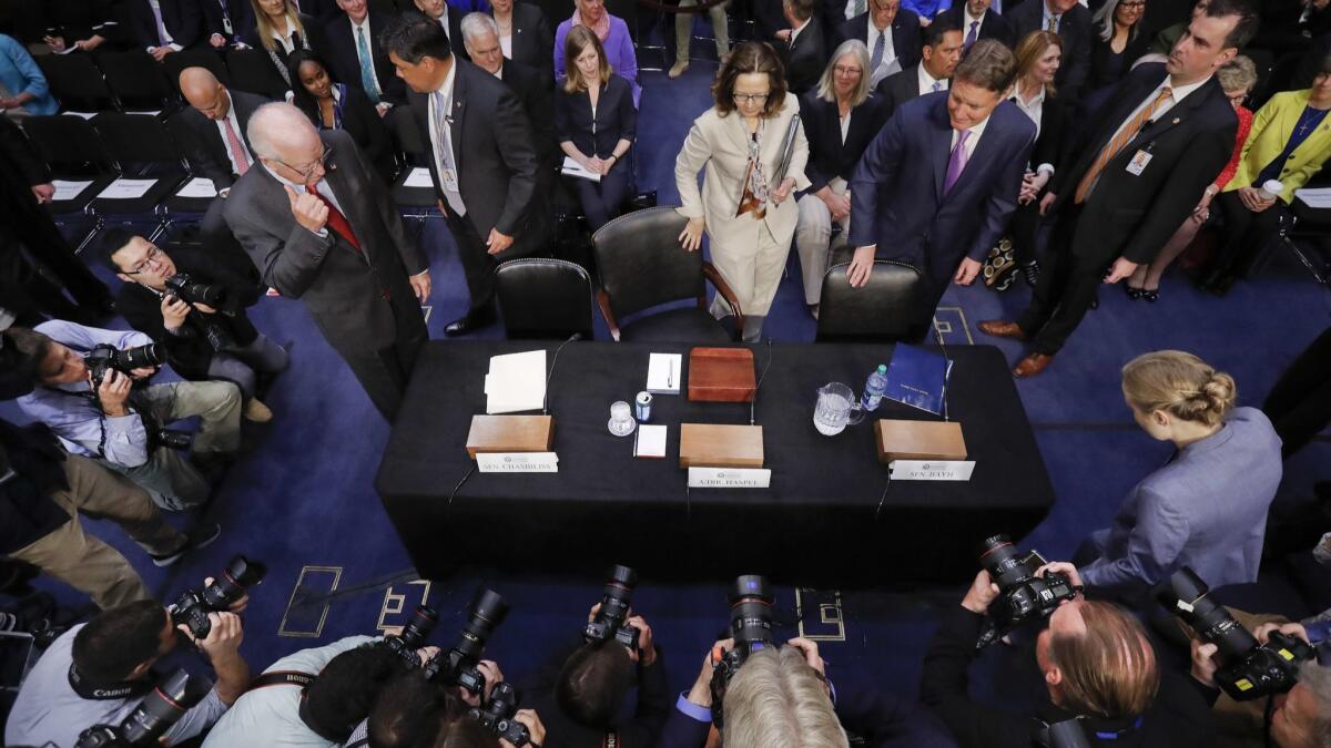 Gina Haspel, President Trump's nominee to lead the CIA, takes her seat for her confirmation hearing before the Senate Intelligence Committee on Wednesday.