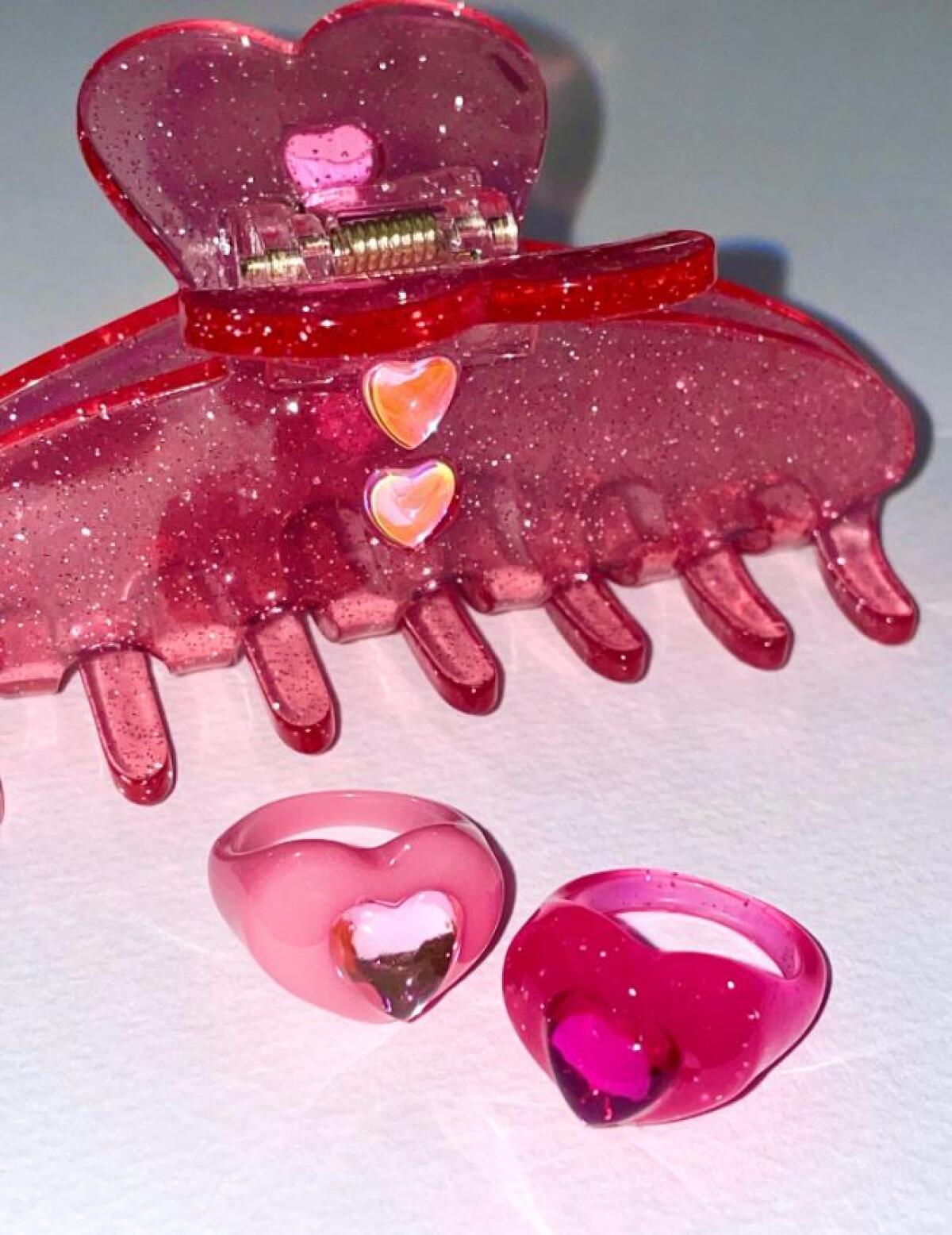 Pink hair clip and two heart-shaped rings