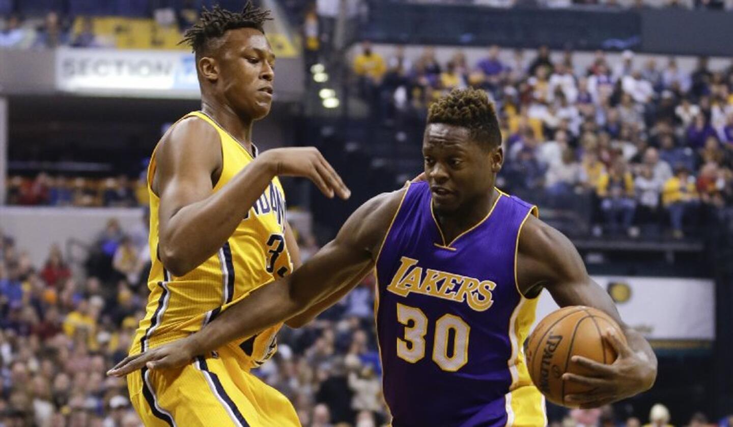 Lakers forward Julius Randle (30) drives by Pacers forward Myles Turner (33) during the first half.