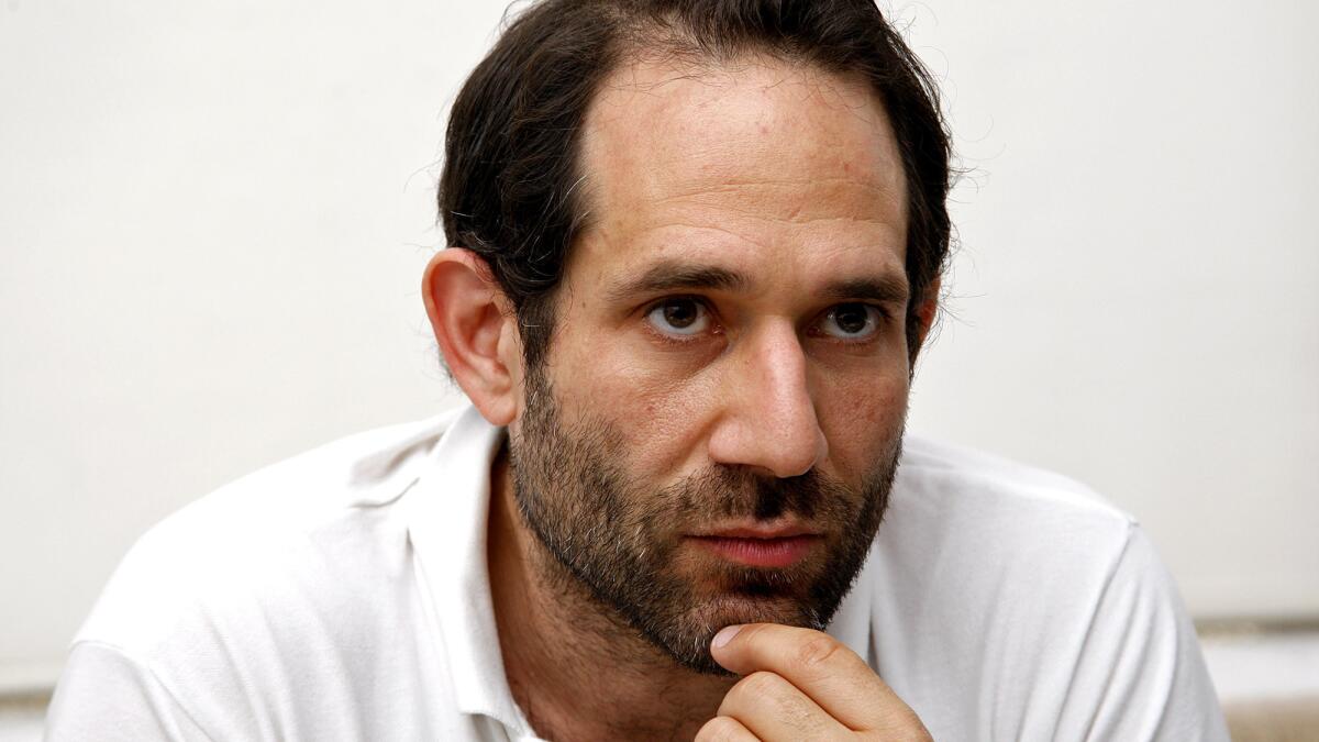 In a lawsuit filed Wednesday, American Apparel founder Dov Charney said members of the company's board of directors, along with hedge fund Standard General, conspired to push him out of the company.