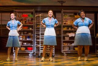 Three waitresses standing in a diner