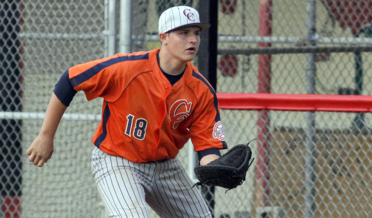 Chatsworth first baseman Thomas Palomera readies to make a catch during a game against Wilmington Banning in March. The Chancellors are listed at No. 8 in this week's high school baseball rankings.