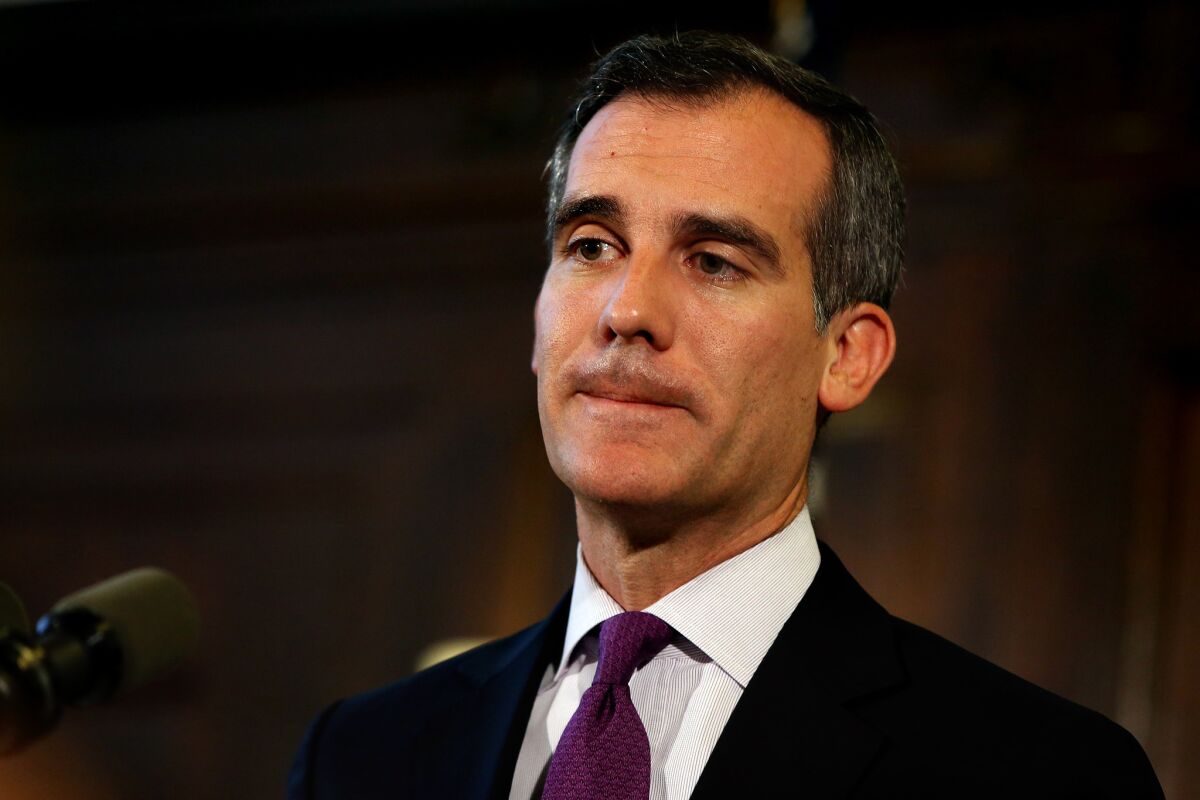 Los Angeles Mayor Eric Garcetti, speaking at City Hall in early June, said Tuesday he would refuse to sign two new ordinances cracking down on homeless people and would block their enforcement until certain provisions are softened.