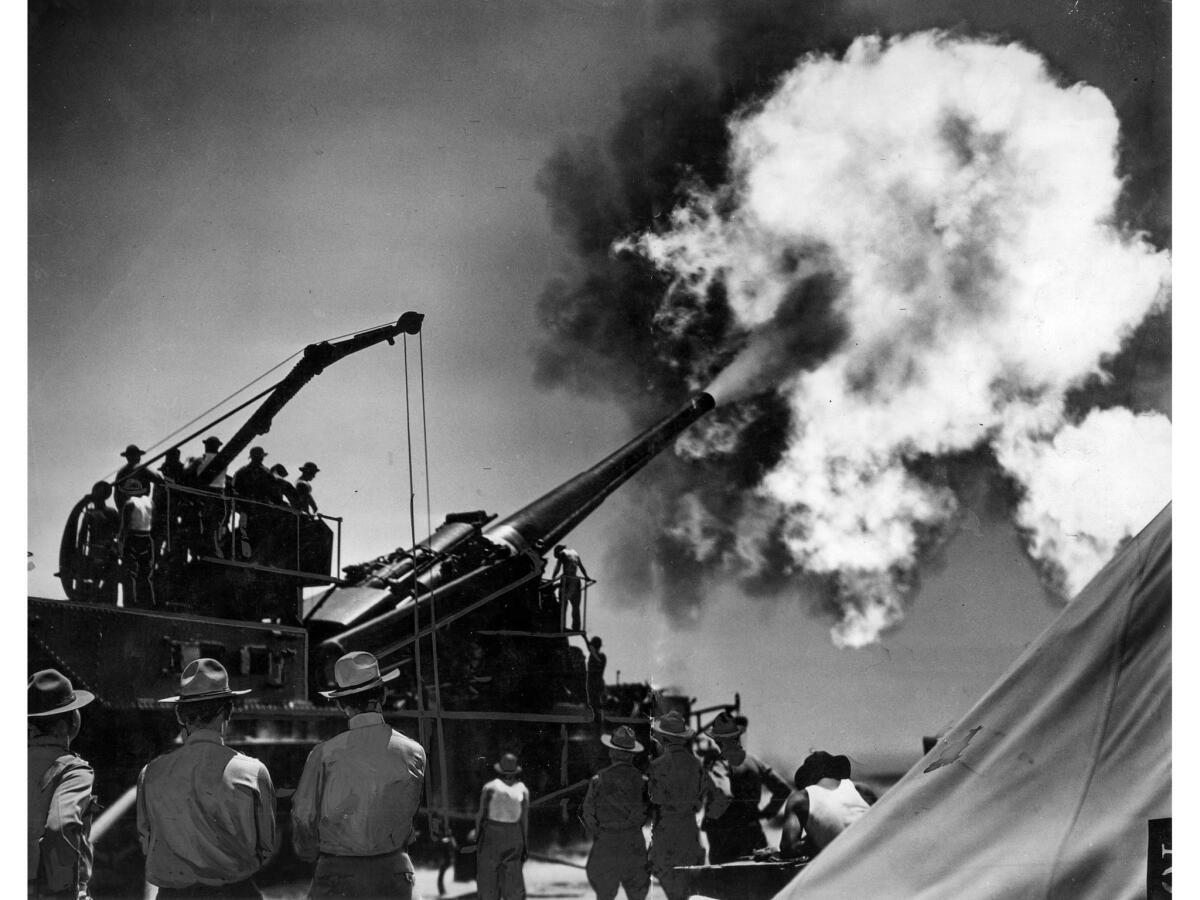 June 12, 1936: A United States Army Coast Defense 14-inch railway gun is fired during target practice near Oceanside, Calif.